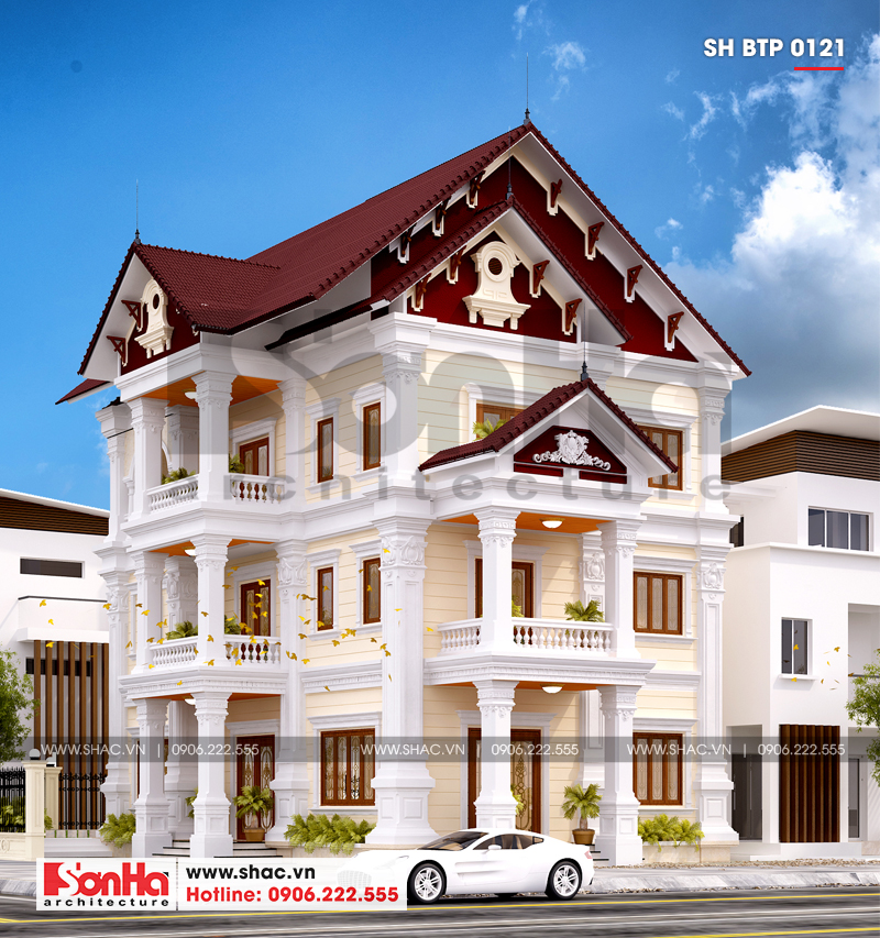 Biệt thự 3 tầng màu vàng kem và trắng với mái ngói nâu đậm