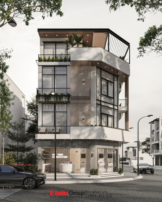 Nhà ống 4 tầng được hiết kế thoáng sáng với các ô kính lấy sáng và sân vườn trên tầng thượng.