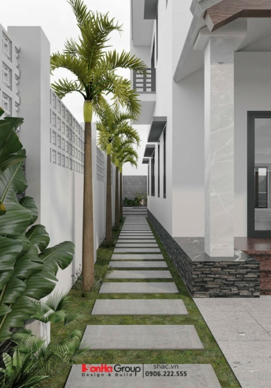 Lối đi cạnh nhà được bố trí cây xanh thoáng mát trong biệt thự song lập kết hợp kinh doanh.