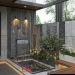 Tường gạch tối màu có phần gai góc kết hợp với ánh sáng vàng đã mang đến vẻ đẹp mộc mạc và nguyên sơ cho góc vườn nhỏ của nhà phố liền kề