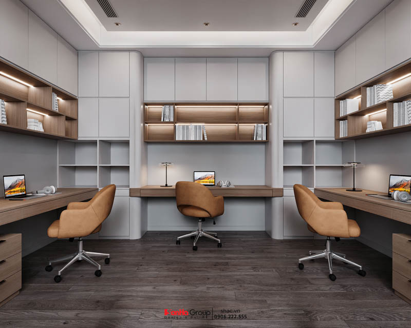 Hệ tủ và bàn học được sắp xếp đối xứng vòng quanh căn phòng