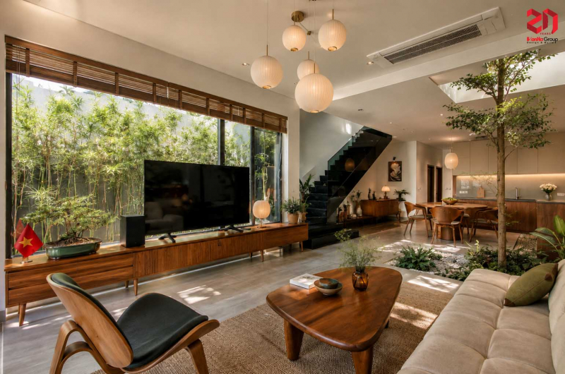 Kiến trúc nhà vườn hiện đại - Xu hướng sống xanh nâng tầm chất lượng cuộc sống 3 Bức tường vách TV thay bằng kính cường lực khổ lớn giúp mở rộng tầm nhìn và tối ưu ánh sáng tự nhiên cho phòng khách