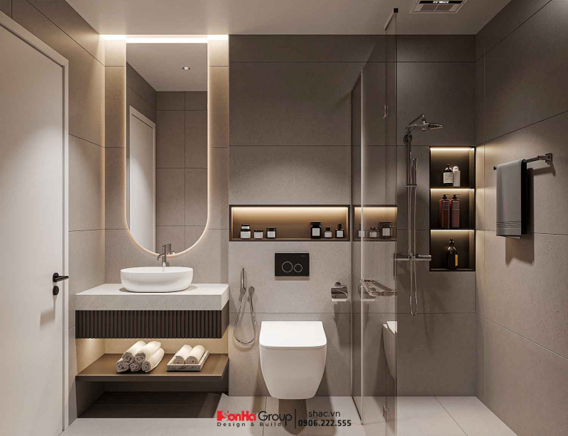 Thiết kế nội thất Vinhomes Vũ Yên: Giải pháp nào giúp nhà 2 tầng vừa đủ 3 phòng ngủ vừa tối ưu không gian kinh doanh? 82 Thiết kế nội thất Vinhomes cho phòng tắm hiện đại với gương LED, vách kính tắm và tông gạch tông nâu tây sang trọng.
